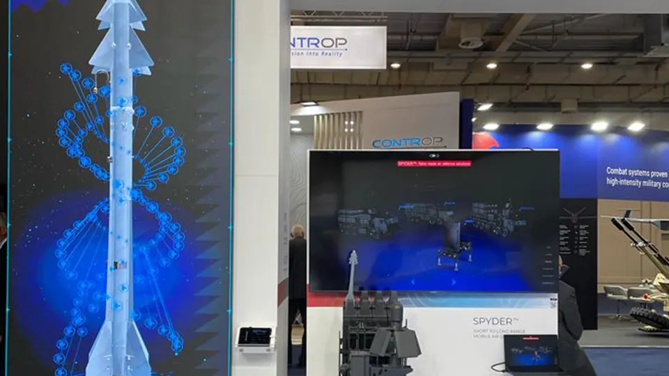 Vertical visualization - A tall illuminated display shows a blue technical model.